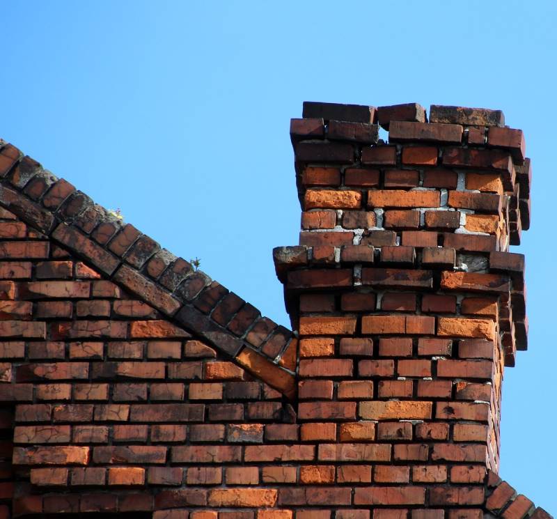 Signs Your Anaheim Home Needs a Chimney Inspection Damaged chimney on an Anaheim home showing cracks and missing mortar
